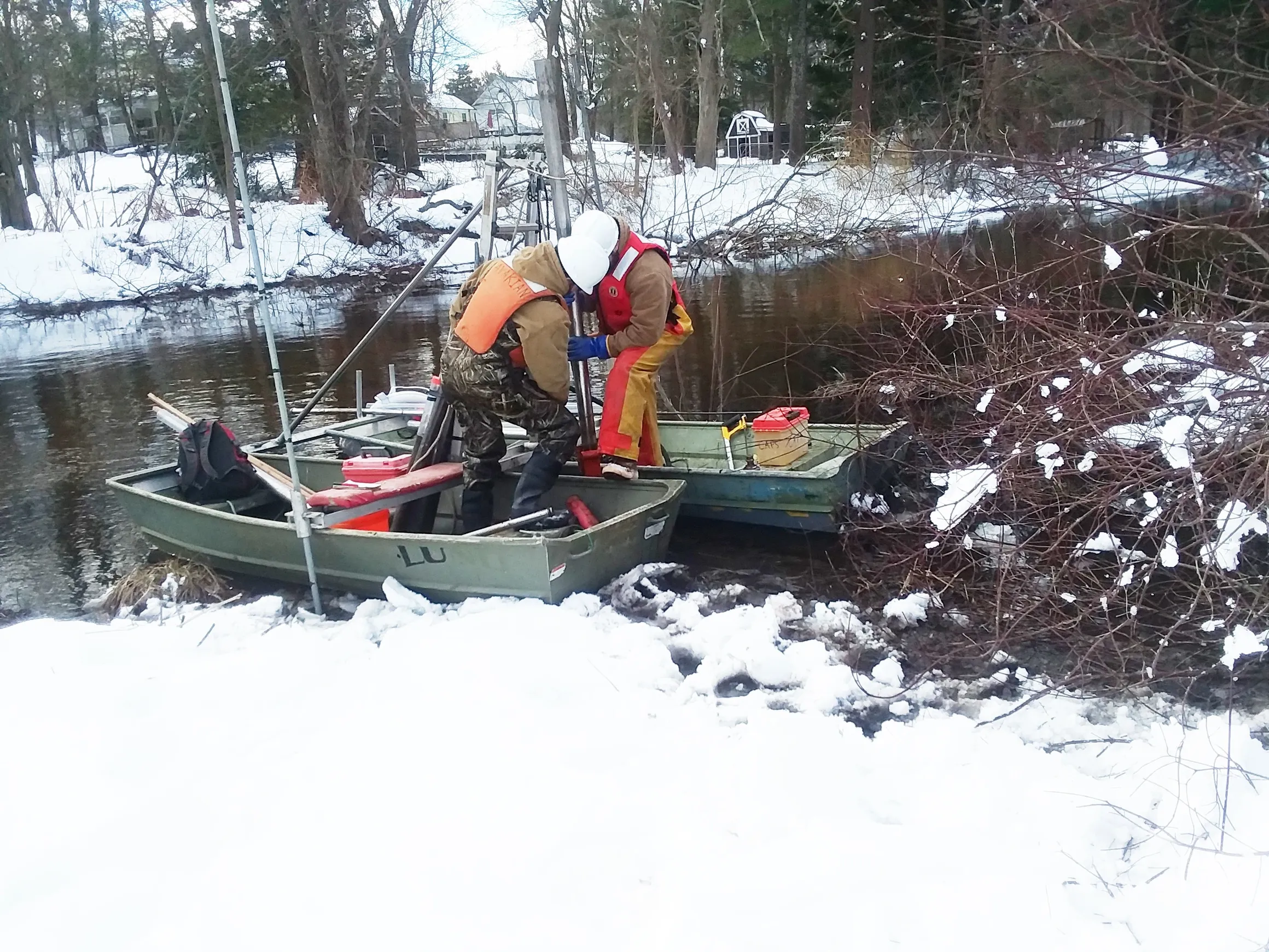 Retrieval — sealed core sample being lifted from the water